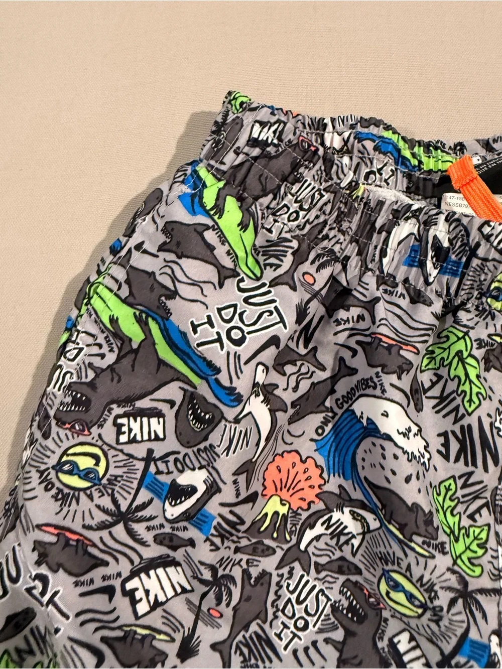 Nike Kids Gray Swim Trunks with Bright Graphic Print